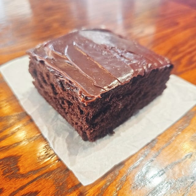 Chocolate Cake Slice W/ Chocolate Icing.